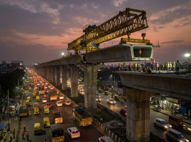 Elevated expressway segments being lifted into place over Kona Road